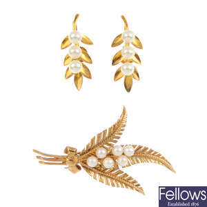 A 9ct gold cultured pearl brooch and a pair of 9ct gold cultured pearl earrings.