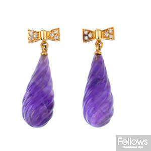A pair of 18ct gold diamond and purple stone earrings.