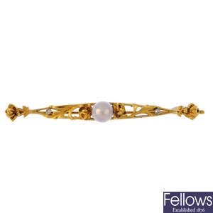 A gold cultured pearl and diamond Art Nouveau bar brooch.