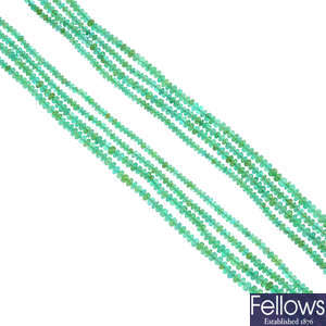 An emerald bead necklace.