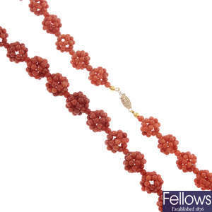 A coral necklace with matching earrings.
