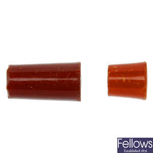 Two natural amber nargile mouthpiece parts.
