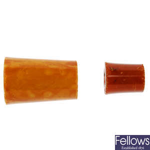 Two natural amber nargile mouthpiece parts.