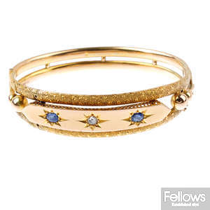 A late Victorian 9ct gold sapphire and diamond hinged bangle.