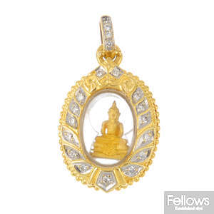 A diamond Buddha pendant.