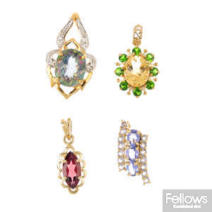 Four 9ct gold gem-set pendants.