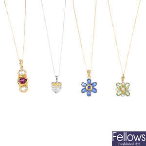 Four 9ct gold gem-set pendants, with chains.