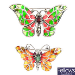 Two gem-set and plique-a-jour butterfly brooches.