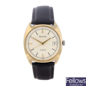 BULOVA - a gentleman's 9ct yellow gold wrist watch.