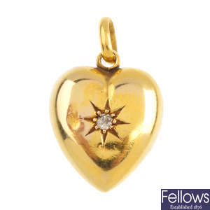 An early 20th century 15ct gold diamond heart pendant.