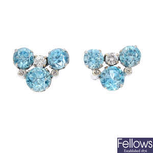 A pair of diamond and zircon earrings.