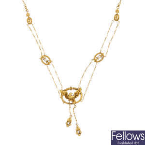 A Belle Epoque 18ct gold seed pearl necklace.