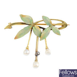 An Art Nouveau gold, enamel and pearl brooch.