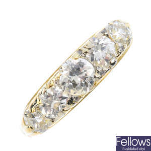 A diamond five-stone ring.