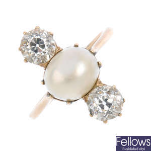 A natural pearl and diamond three-stone ring.