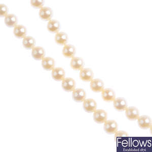 A selection of cultured pearl strands and gemstones.