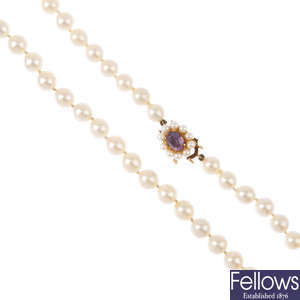 A cultured pearl necklace, with 9ct gold gem-set clasp.