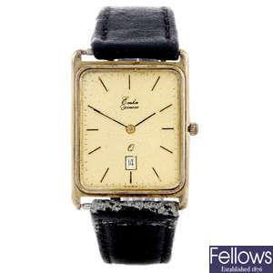 EMKA - a gentleman's 9ct yellow gold wrist watch with a gold plated watch head.