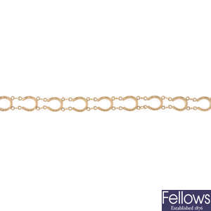 A 9ct gold horseshoe bracelet.