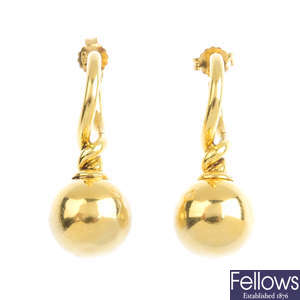 A pair of 18ct gold earrings.
