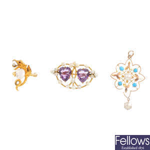 A gem-set pendant and two gem-set brooches.