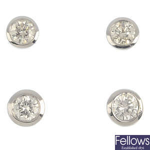 Three pairs of 18ct gold brilliant-cut diamond single-stone stud earrings.