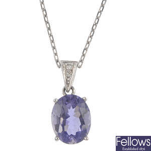 An 18ct gold iolite and diamond pendant, with chain.
