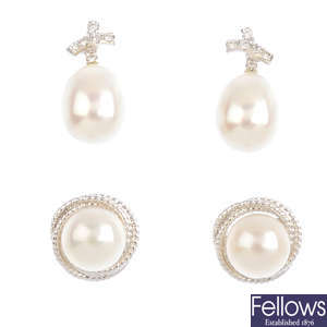 Six pairs of gold cultured pearl and diamond earrings.