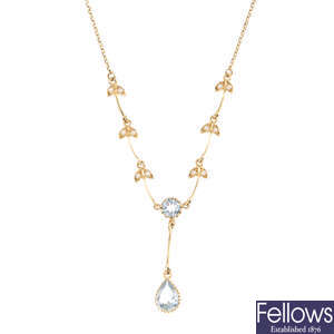 A 9ct gold aquamarine and split pearl necklace.