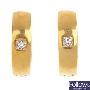 A pair of 18ct gold diamond hinged earrings.