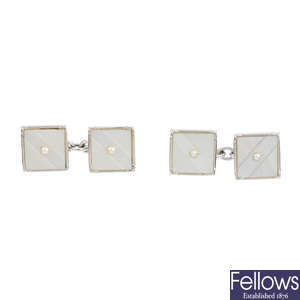 A pair of mother-of-pearl cufflinks and two dress studs.