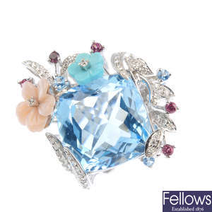 A diamond and gem-set dress ring.