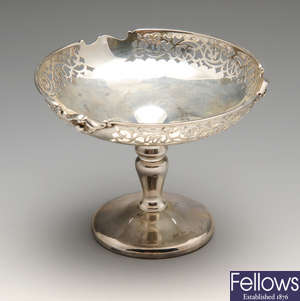 An early twentieth century small silver tazza, Victorian bonbon dish and a pair of butter shells.