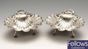 A pair of modern silver bonbon dishes of shell form.