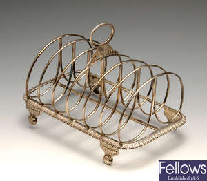 A George IV silver six-divide toast rack.