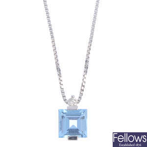 A topaz and diamond pendant, with chain.