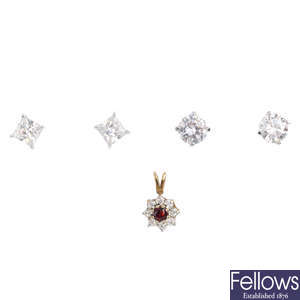 A selection of gem-set earrings and pendants.