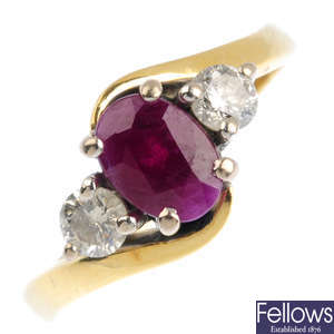 An 18ct gold ruby and diamond three-stone crossover ring.