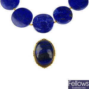 A lapis lazuli necklace, brooch and pair of earrings.
