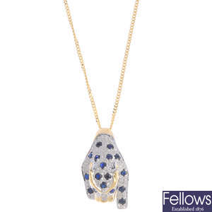 A sapphire leopard pendant, with 18ct gold chain.