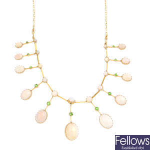An early 20th century gold, opal and demantoid garnet fringe necklace.