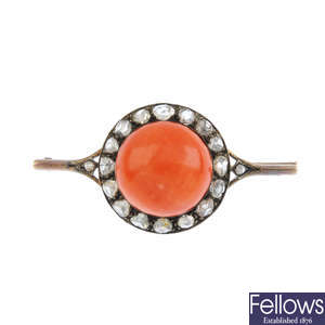 A mid 20th century coral and diamond brooch.