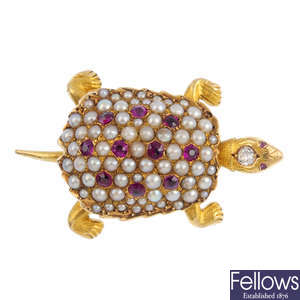 An early 20th century gold, diamond and gem-set turtle slide.