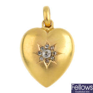 An Edwardian 15ct gold diamond heart pendant.