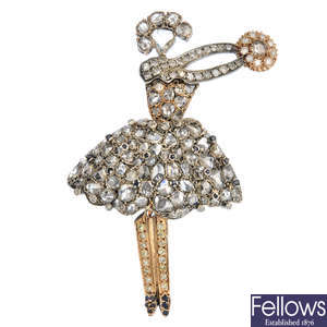 A diamond and sapphire ballerina pendant.