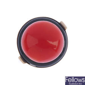 A mid 20th century gold coral and onyx ring.
