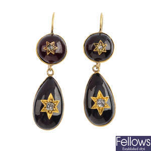 A pair of late 19th century garnet and diamond earrings.
