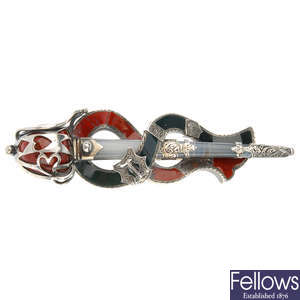A mid Victorian silver and agate sword brooch.