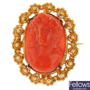 A carved coral brooch.