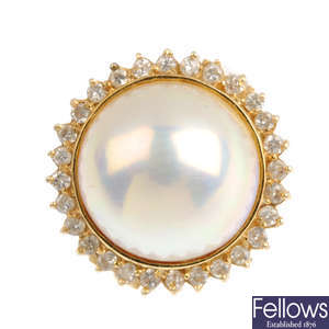 A mabe pearl and diamond cluster ring.